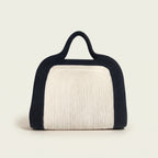 Elainor artisan cotton cord clutch bag with handle by Leila lifestyle view