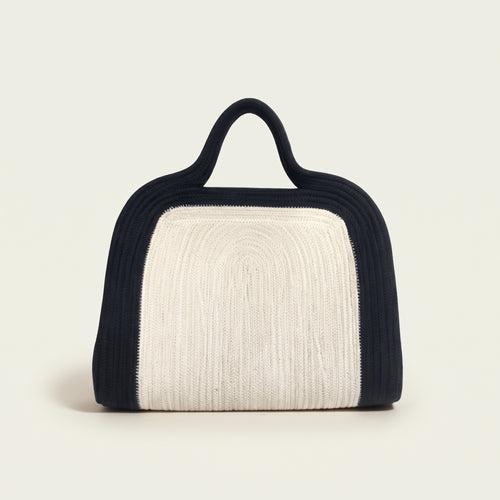 Elainor artisan cotton cord clutch bag with handle by Leila lifestyle view