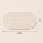 Alabaster oval cotton cord table mat showing 19 inch length and 10 inch width