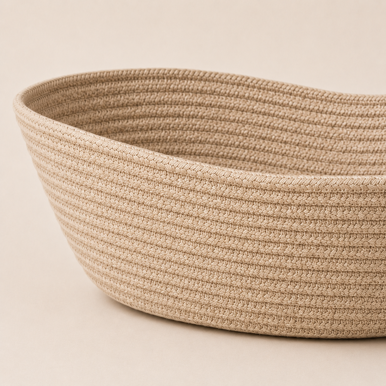Close-up of solid beige cotton cord fruit basket texture