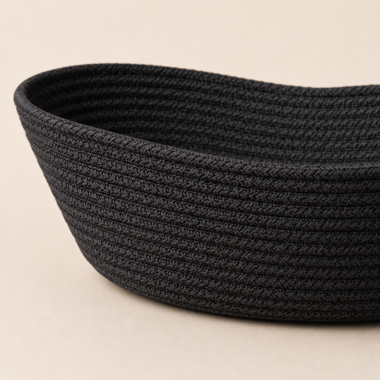 Close-up of solid black cotton cord fruit basket texture