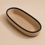 Braided jute cutlery holder with black border shown at an angle by Leila Lanka