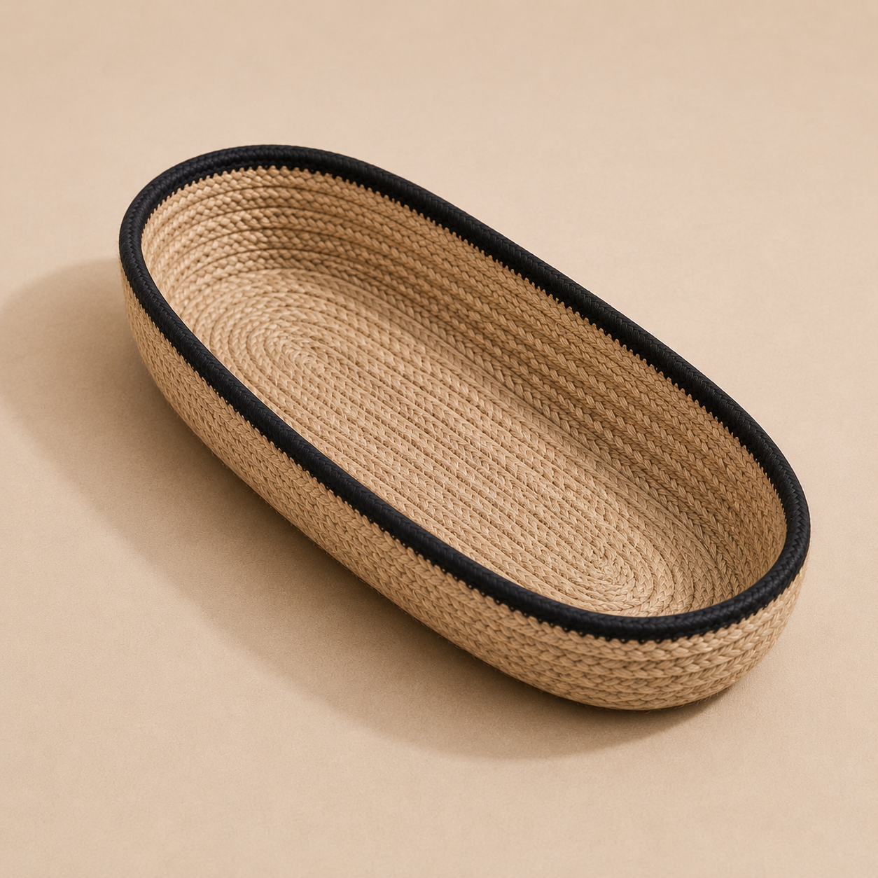 Braided jute cutlery holder with black border shown at an angle by Leila Lanka