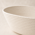 Close-up of solid off-white cotton cord fruit basket texture