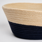 Close-up of beige and black handwoven cotton cord basket texture